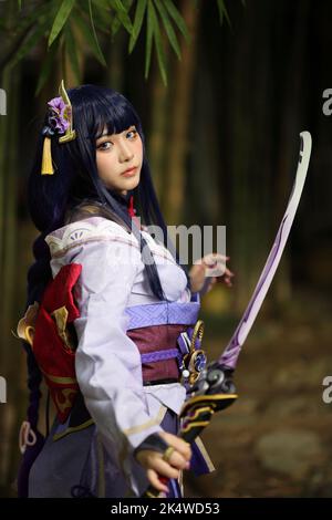 Portrait Of A Beautiful Young Woman Game Cosplay With Samurai Dress Costume  On Japanese Garden Stock Photo - Download Image Now - iStock