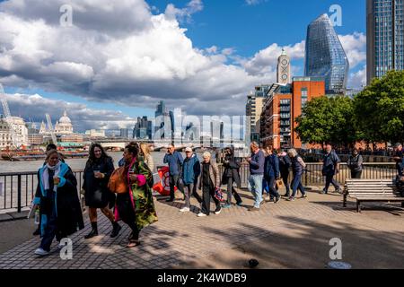 British People and People From Around The World Queue Along The Southbank To See The Queen Lying-In-State At Westminster Hall, London, UK. Stock Photo