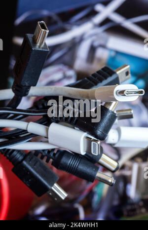 Schwerin, Germany. 04th Oct, 2022. A bundle of different charging cables for electrical devices such as cell phones or laptops. There are to be uniform charging cables in the EU from 2024. The EU Parliament has given its final approval to the uniform USB-C charging standard for smartphones and many other devices. Credit: Jens Büttner/dpa/17�Թ����� Live News Stock Photo