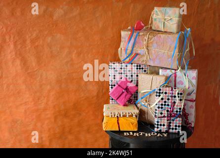 heap of birthday presents and caption happy birthday,personal gifts and decoartion,happy birthday concept, free copy space Stock Photo