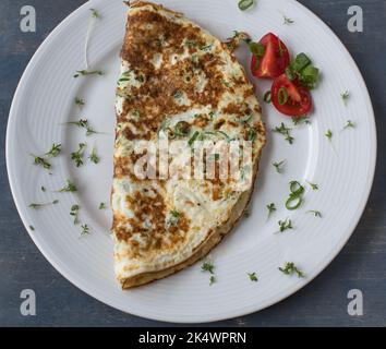 Egg white omelette isolated on a white plate Stock Photo