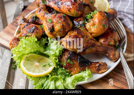 Heap with chicken drumsticks on a plate Stock Photo