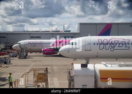 LUTON, UK - JULY 12, 2019: Wizz Air Airbus A320 fleet at London Luton Airport in the UK. It is UK's 5th busiest airport with 16.5 million annual passe Stock Photo