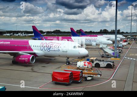 LUTON, UK - JULY 12, 2019: Wizz Air Airbus A320 fleet at London Luton Airport in the UK. It is UK's 5th busiest airport with 16.5 million annual passe Stock Photo