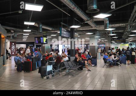 LUTON, UK - JULY 12, 2019: Passengers visit London Luton Airport in the UK. It is UK's 5th busiest airport with 16.5 million annual passengers. Stock Photo