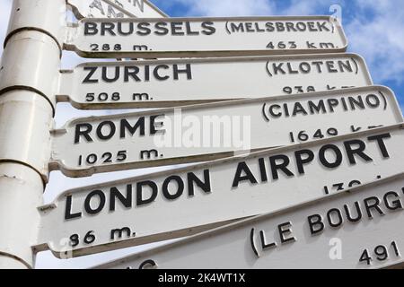 Destination signs in Europe - old sign at Birmingham Airport, UK. Distances to Rome, London, Zurich and Brussels. Stock Photo