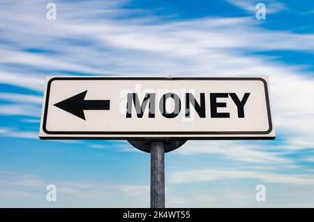 Money direction road sign on blue sky background. Stock Photo