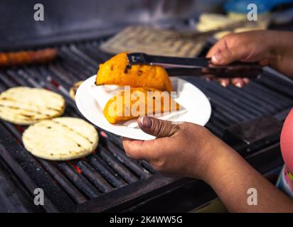 Arepa chocolo on the grill - Traditional Colombian food Stock