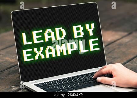 Text caption presenting Lead By Example. Word for Be a mentor leader follow the rules give examples Coach Stock Photo