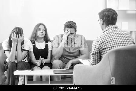 parents with kid talk to social worker. mom dad and daughter. life insurance and adoption Stock Photo