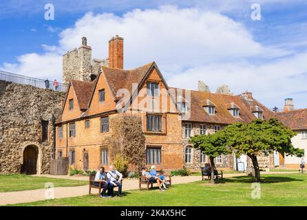 Framlingham castle people sat on benches in the Inner Ward with the Workhouse behind them Framlingham Castle Framlingham Suffolk England UK GB Europe Stock Photo