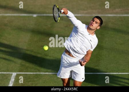 Spanish tennis player Carlos Alcaraz playing overhead smash during Wimbledon Championships 2022, London, England, United Kingdom