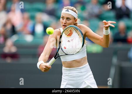 French tennis player Kristina Mladenovic playing a backhand shot during Wimbledon Championships 2022, London, England, United Kingdom Stock Photo