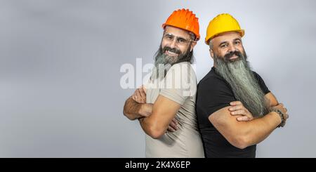 workers with smiling elements on gray background Stock Photo