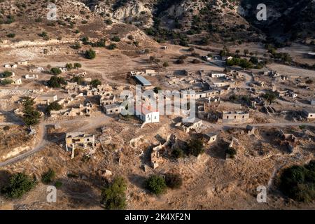 Aerial view of the Turkish Cypriot village of Souskiou (Susuz) in the Diarizos Valley, Paphos region,  Cyprus. The village was abandoned in July 1974. Stock Photo