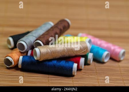 Sewing thread, spools of thread in different colors Stock Photo