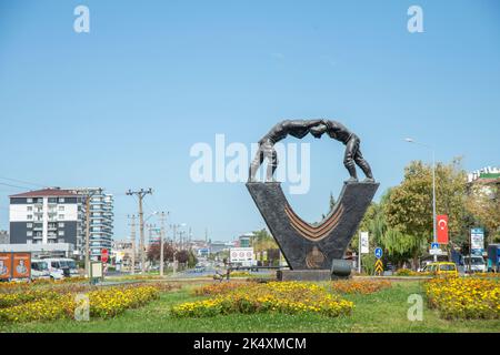 Edirne, oil wrestler statue at the entrance to the city.Kırkpınar is a Turkish oil wrestling tournament where wrestlers compete for three days. Stock Photo