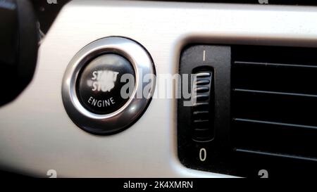 Car engine start button black and white close-up with blurred background Stock Photo