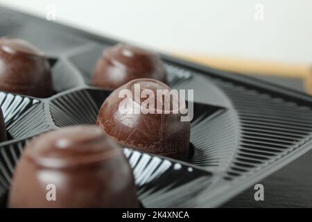 Chocolate candy cases are in a candy blister. Shopping candy sweet day chocolate how to choose candy. Gift boxes of chocolates. Stock Photo