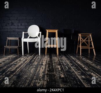 A row of five empty modern chairs in front of a stylish brick wall. Shot on a black wall in a dark key. Stock Photo