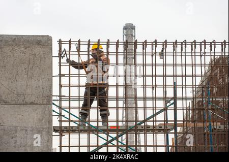 A man working on scaffolding Stock Photo