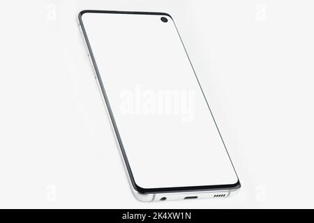 Smartphone with a white display on a white isolated background. Copyspace Stock Photo