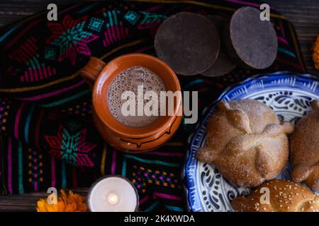 clay cup of Mexican hot chocolate on table in Mexico Stock Photo