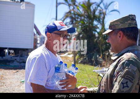 Florida Army National Guard Assistant Adjutant General, Maj. Gen. John Haas, conducts an on ground reconnaissance to evaluate the situation and current status of Pine Island, Florida in the aftermath of Hurricane Ian, Oct. 3, 2022. He listened to our fellow Floridians and local residents and reassured them help is on the way. Stock Photo