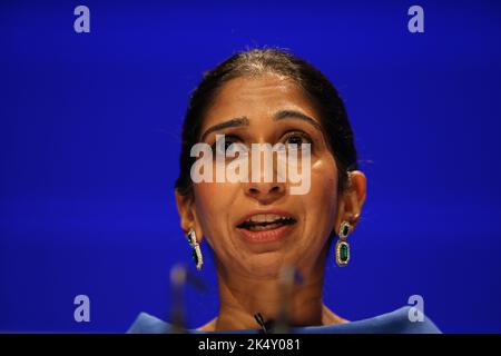 Birmingham, UK. 4 October, 2022. Home Secretary Suella Braverman delivers her speech during the Conservative Party's annual conference at the International Convention Centre in Birmingham. Picture date: Monday October 4, 2022. Credit: Isabel Infantes/Empics/Alamy Live News Stock Photo