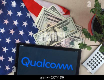 In this photo illustration, the Qualcomm Inc. logo is seen displayed on ...