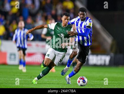 Plymouth Argyle forward Morgan Whittaker (19) goes past Sheffield Wednesday midfielder Josh Windass  (11)  during the Sky Bet League 1 match Plymouth Argyle vs Sheffield Wednesday at Home Park, Plymouth, United Kingdom, 4th October 2022  (Photo by Stanley Kasala/News Images) Stock Photo