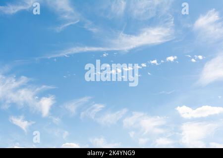 Blue sky with scattered clouds Stock Photo