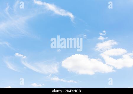 Blue sky with scattered clouds Stock Photo