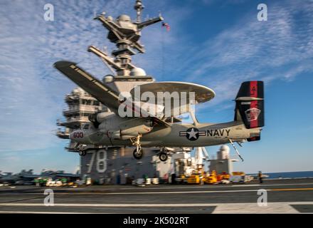 ATLANTIC OCEAN (Nov. 14, 2020) An E-2C Hawkeye attached to the 'Bear Aces' of Airborne Command and Control Squadron (VAW) 124 prepares to land aboard the aircraft carrier USS Gerald R. Ford (CVN 78), Nov. 14, 2020. Gerald R. Ford is underway in the Atlantic Ocean conducting first-ever integrated carrier strike group operations with Carrier Air Wing 8, Destroyer Squadron 2 and their air and missile defense commander, commanding officer of the aircraft carrier USS Gettysburg (CG 64). (U.S. Navy photo by Mass Communication Specialist 2nd Class Kallysta Castillo) Stock Photo