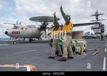 ATLANTIC OCEAN (March 29, 2022) Sailors assigned to the air department of the aircraft carrier USS Gerald R. Ford (CVN 78) prepare to launch an E2-D Hawkeye attached to the 'Bear Aces' of Airborne Command and Control Squadron (VAW) 124 in the Atlantic Ocean, March 29, 2022. Gerald R. Ford is underway in the Atlantic Ocean conducting flight deck certification and air wing carrier qualifications as part of the shipÕs tailored basic phase prior to operational deployment. (U.S. Navy photo by Mass Communication Specialist 2nd Class Zachary Melvin) Stock Photo