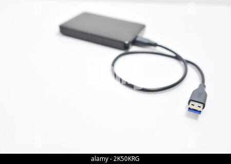 Isolated external hard drive or hard disk or HDD on white background. Stock Photo