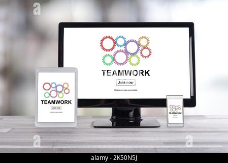 Teamwork concept shown on different information technology devices Stock Photo