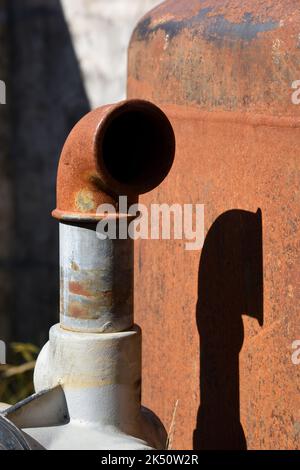 Old Rusty Pipes of Old Water Tank or Rusty Boiler Stock Photo