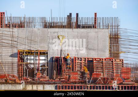 Anonymous engineer working at construction site on sunny day Stock Photo