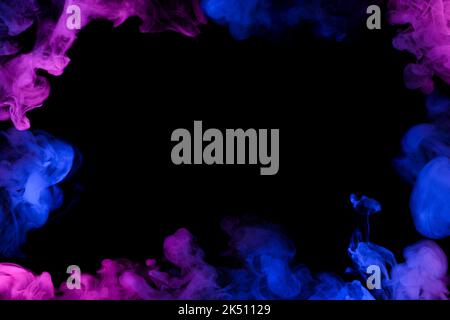Flowing clouds of neon smoke frame with copy-space in center dark abstract background Stock Photo