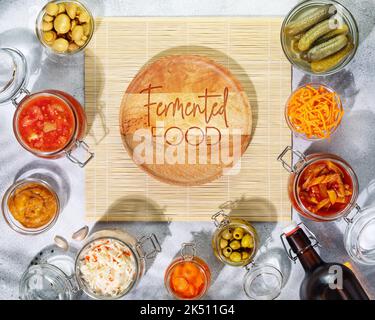 Fermented products vegetables, mushrooms in glass jars, bottle with beer Stock Photo