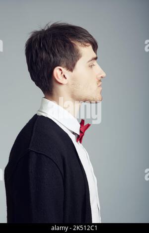 The profile of refinement. a handsome and stylish young man posing in the studio. Stock Photo