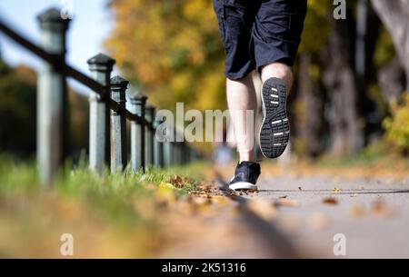 Munich, Germany. 05th Oct, 2022. A man jogs along the Nymphenburg Canal. Credit: Sven Hoppe/dpa/Alamy Live News Stock Photo