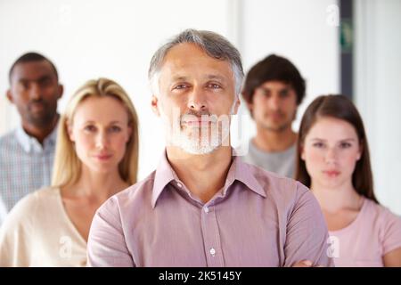 It takes all kinds to make a business work. a diverse group of colleagues in the office. Stock Photo