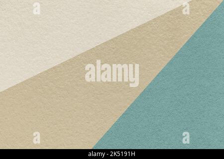 Texture of old craft beige, blue and ivory color paper background, macro. Structure of vintage abstract cerulean cardboard with gradient and rainbow p Stock Photo