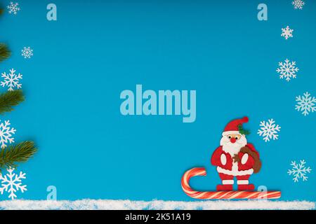 santa claus on a sleigh on a blue background Stock Photo