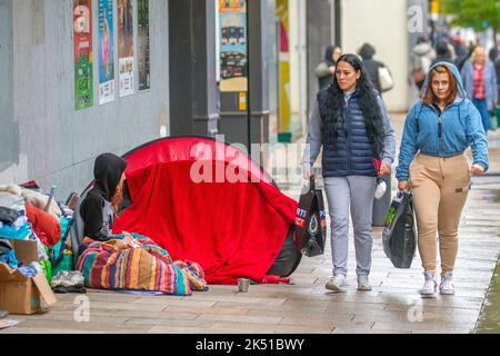 Rough sleepers with pavement tent in Preston. UK Weather  Oct, 2022; Wet and windy start to the day in the northwest of England. A windy day with variable cloud and scattered, blustery showers, some of which will be heavy. Stock Photo