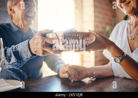 Box, love and senior couple with a gift exchange in celebration of a romantic and happy marriage anniversary. Smile, romance and married man giving an Stock Photo