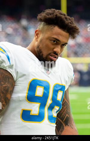 Los Angeles Chargers defensive tackle Sebastian Joseph-Day (69) and  linebacker Troy Reeder (42) tackle Seattle Seahawks quarterback Sean  Mannion (9) in the end zone for a safety during the second half of