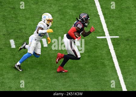 Houston Texans wide receiver John Metchie III (88) catches a pass and  breaks away for a firs down in the third quarter of the NFL Football Game  between the Los Angeles Chargers